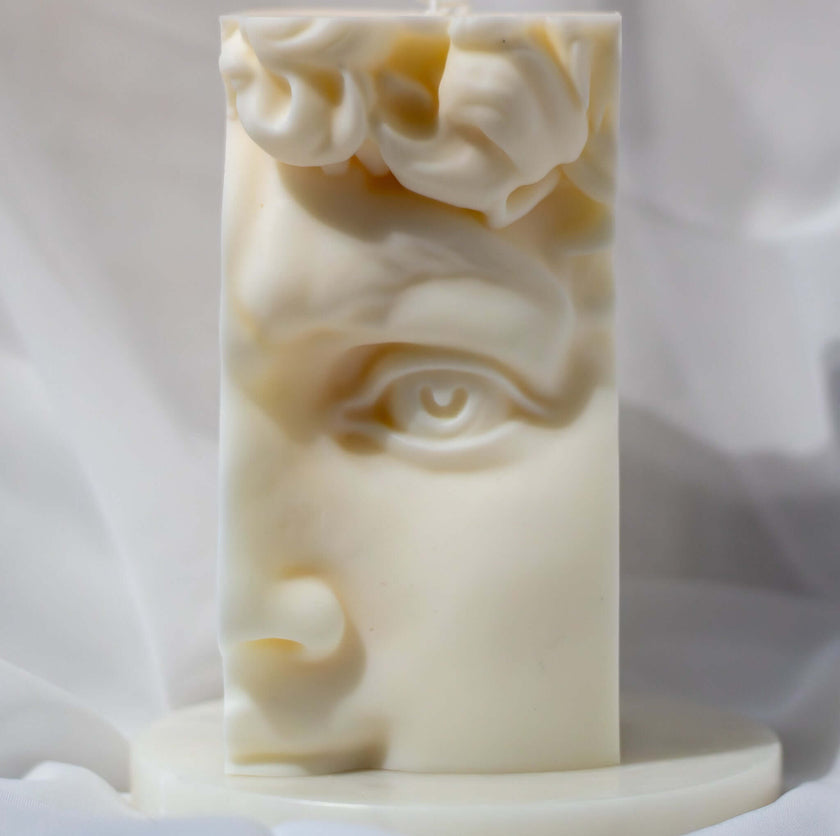 Soy wax candle shaped as David’s face – sculptural scented bust candle for modern classical decor.