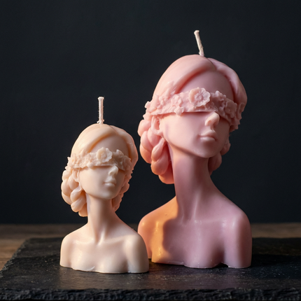 blindfolded-lady-candle-handmade-soy-candle-sculpture-feminine-art-decor-symbolic-gift-for-her-small-elegant-shelf-accent - lit candle