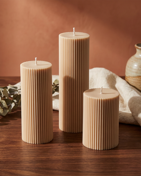 Textured ribbed pillar candles with a chic, cozy vibe, handcrafted from natural soy wax, perfect for home decor, weddings, special events, and meaningful gifts - lit candle