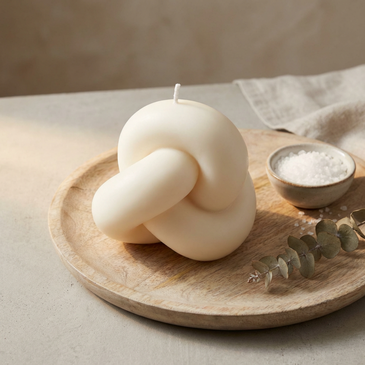 handcrafted-knot-candle-sculptural-soy-wax-home-decor-piece-unique-accent-for-modern-spaces-perfect-gift-for-special-occasions - lit candle