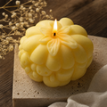 Orange Jack O Lantern candle for Halloween shelf decor