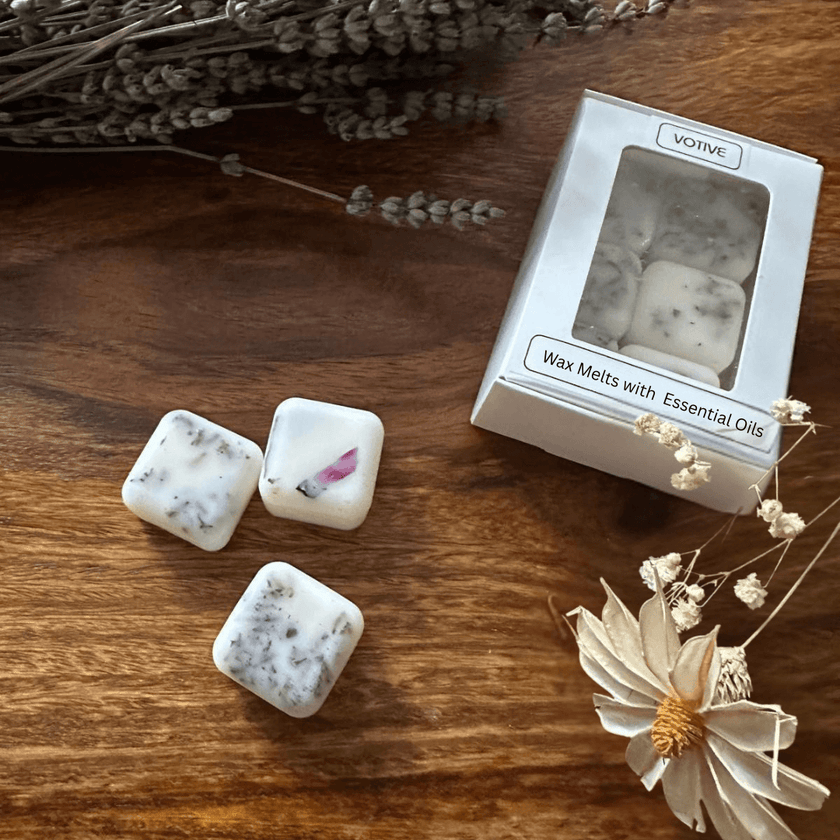 VOTIVE aromatherapy wax melts, non-toxic and vegan, displayed with a ceramic wax warmer