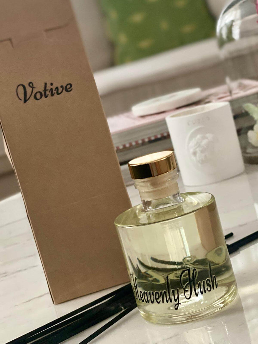 VOTIVE reed diffuser set as a housewarming gift with green ribbon and plant decor

