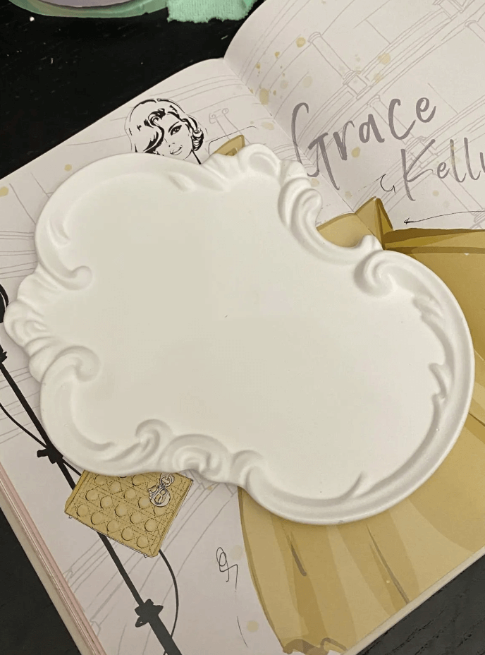 Victorian bathroom tray on a coffee table book.

