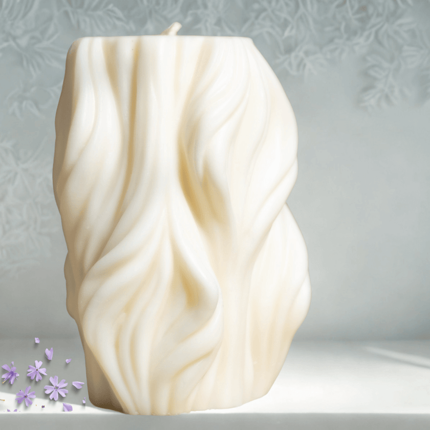 Wavy sculptural soy wax candle with elegant texture, perfect for home decor and ambiance.