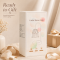 A white rectangular product box for a 'Candle Warmer Lamp' with a simple line drawing of the lamp on the front, styled on a beige surface with soft cream fabric, ribbon, and dried flowers. The text 'Ready to Gift' appears in the upper left.