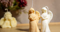 Angelic Love decorative candle displayed on a wooden surface, adding a serene and heartfelt touch to home décor.