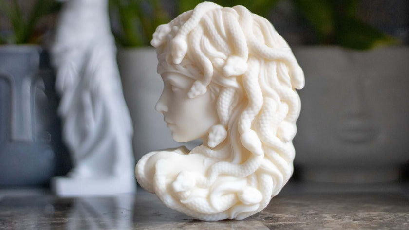 Close-up of the Medusa candle, showcasing intricate facial details and a unique textured finish.