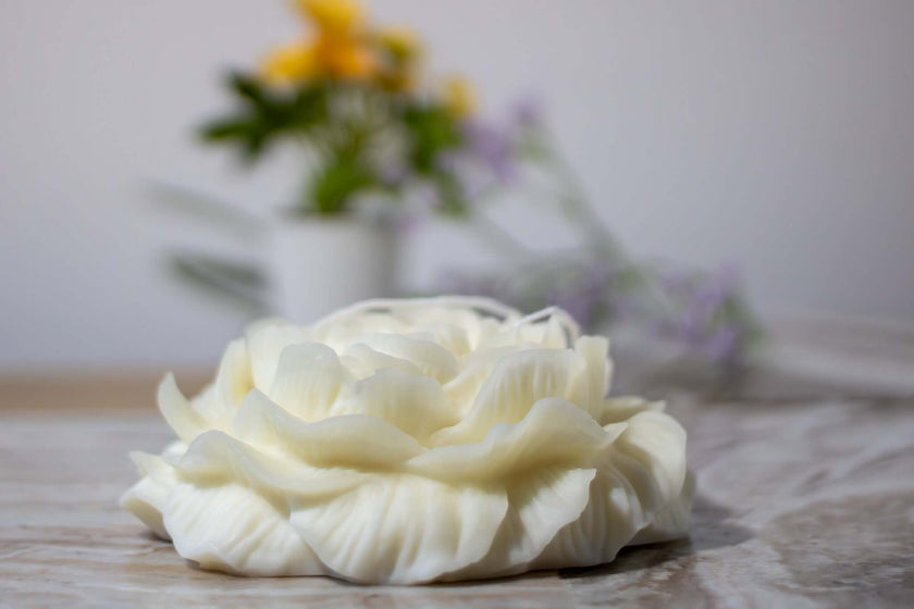 Hand-poured floral decorative candle in an intricate peony shape, perfect for enhancing home interiors with a touch of sophistication.