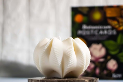 Handcrafted geometric-shaped decorative candle, made from natural wax with an intricate sculptural design.