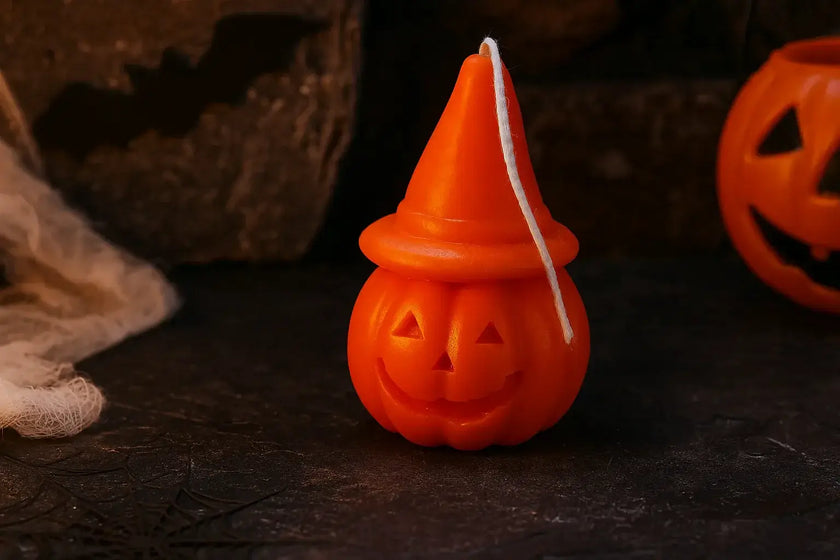 Handmade Halloween pumpkin hat candle sculpted from natural soy wax, eco-friendly and festive.