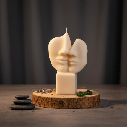abstract-face-candle-handmade-soy-candle-with-two-faces-on-stone-base-modern-art-decor-unique-gift-contemporary-sculpture-accent - lit candle