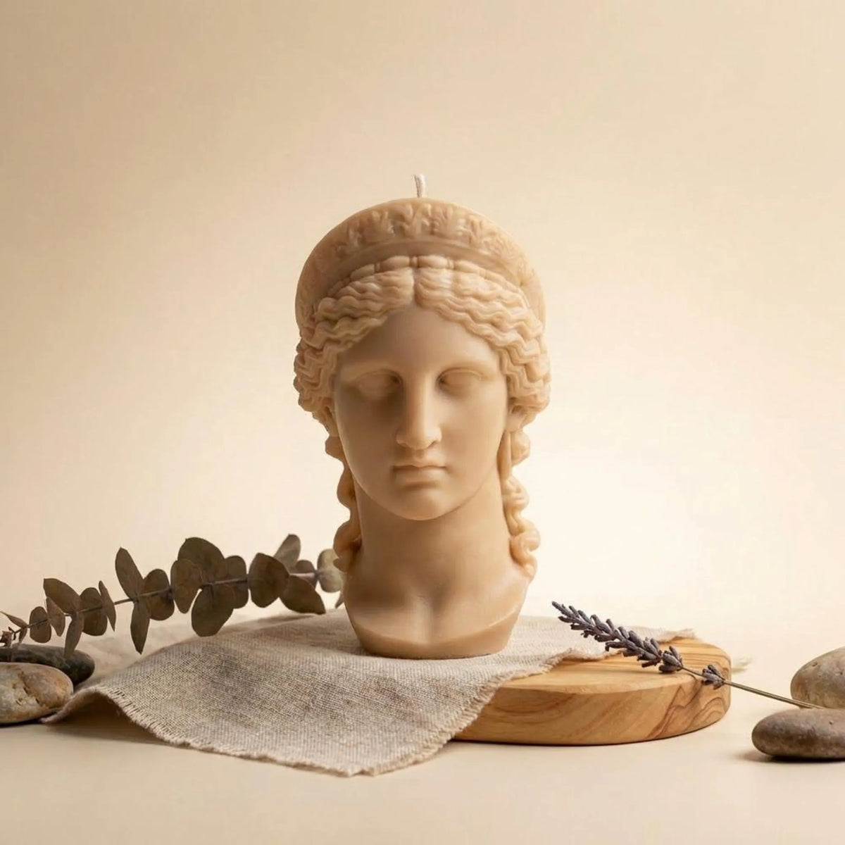 hera-bust-statue-candle-handmade-soy-wax-sculpture-elegant-greek-goddess-decor-unique-gift-sculptural-candle-for-home-accent - lit candle