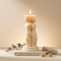 Venus caryatid candle lit – architectural soy wax column candle