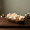 Botanical dough bowl candle with handmade soy wax flowers in a wooden bowl