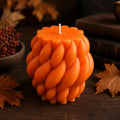 Cable Knit Pillar Candle – lit on coffee table