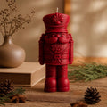 Nutcracker gift candle - close-up of hand-finished uniform detail