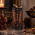Gothic butterfly pillar candle with sculpted skulls – soy wax sculptural candle – view 3