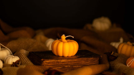 Handcrafted pumpkin-shaped decorative candle made from 100% natural wax, perfect for autumn decor.