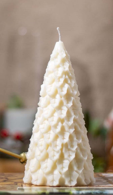 Handcrafted Christmas Fir Festivity candle, shaped like a festive pine tree and made from natural wax.