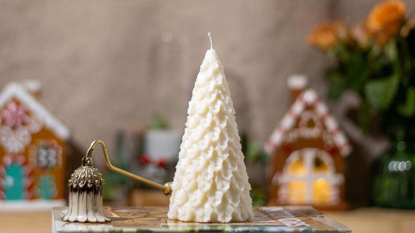 Handcrafted Christmas Fir Festivity candle, shaped like a festive pine tree and made from natural wax.