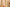 Two cylindrical candles of different heights on a neutral background with flowers.