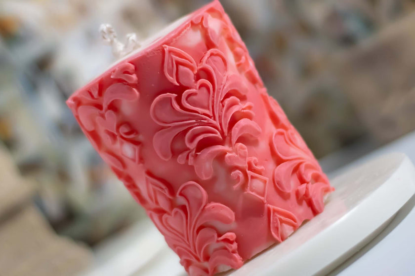 Close-up of the Florence Pillar candle, featuring a rich pink hue and detailed ornamental patterns for a luxurious aesthetic.
