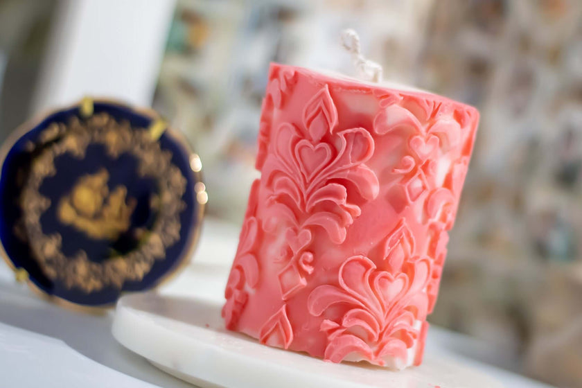 Handcrafted Florence Pillar decorative candle with intricate baroque-style engravings, made from natural wax for an elegant touch.