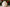 Decorative white candle with floral patterns on a Christmas-themed background
